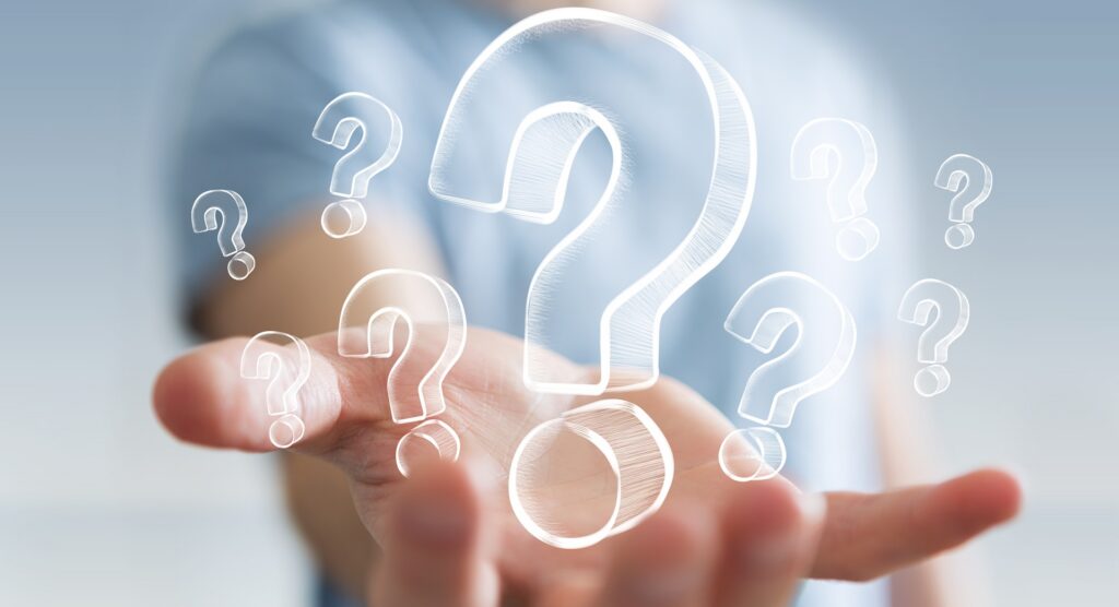 An outreached hand with its palm up with floating question mark graphics above it.